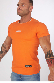 Garrott casual dressed orange t shirt upper body 0002.jpg